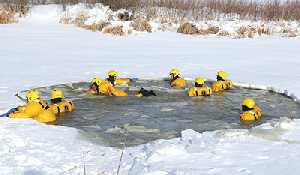 Firefighters dive into water rescue training